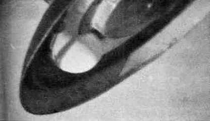Close crop of the underside from R. L. Coker's analysis page. Rocket engineer Walther Riedel told James Moseley in December 1953 that a microscope reveals the GE trademark on one of the ball landing-gear bulbs (Moseley, Shockingly Close to the Truth, p. 69); Coker notes the reflections of three floodlights on the bulb, indicating an indoor shot.