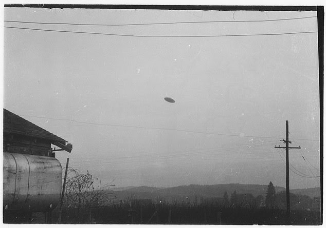 Another print of Trent photo 1, showing the full frame with the telephone pole at right and the power wires the skeptical camp says supported a hanging model.