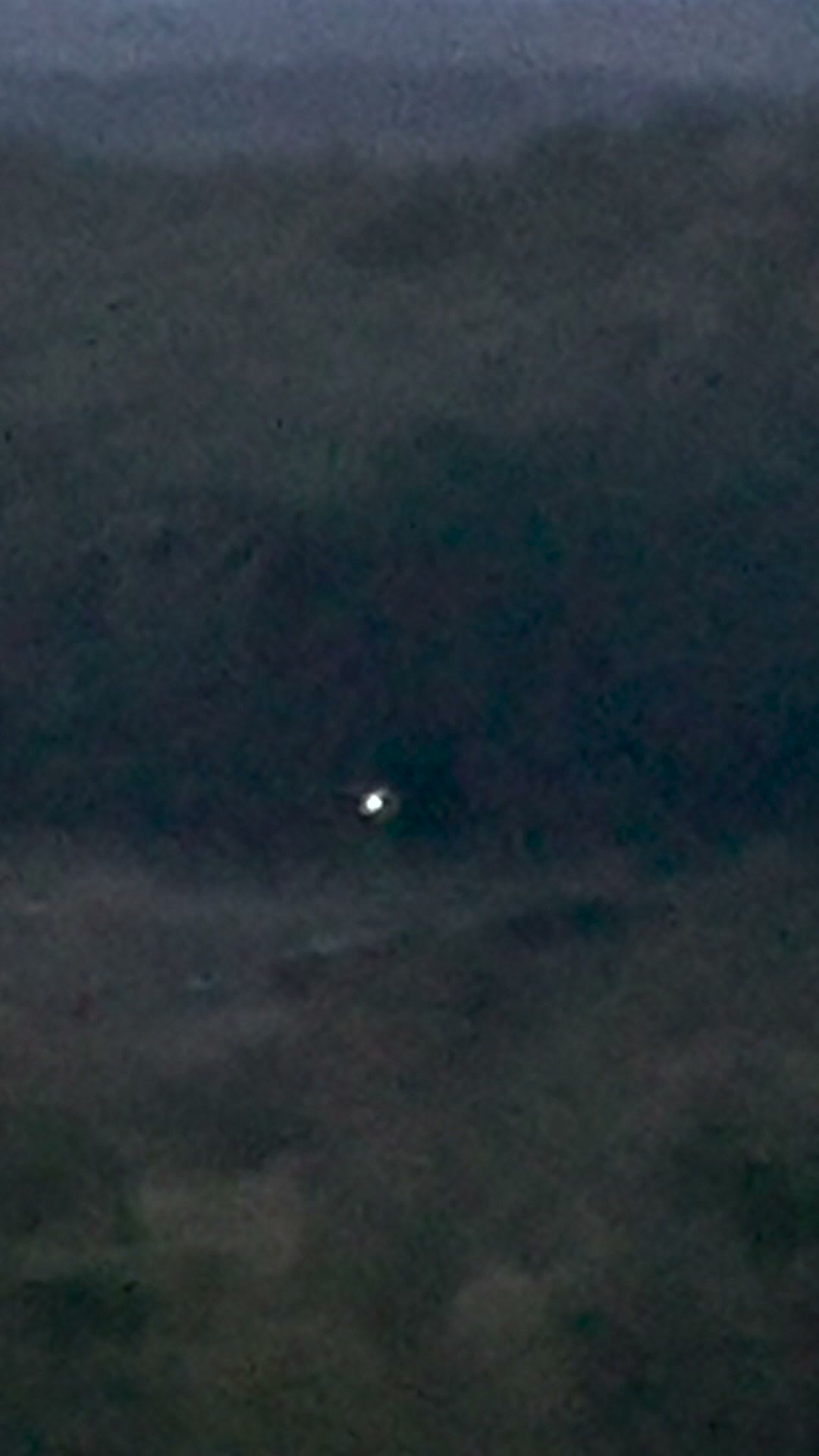 A frame from FBI-UAP-PR003, the October 2024 clip the FBI describes as a plasma-like sphere hovering above a pond at roughly 2,700 feet for about 45 minutes. Public domain, U.S. Government (FBI) via DVIDS.