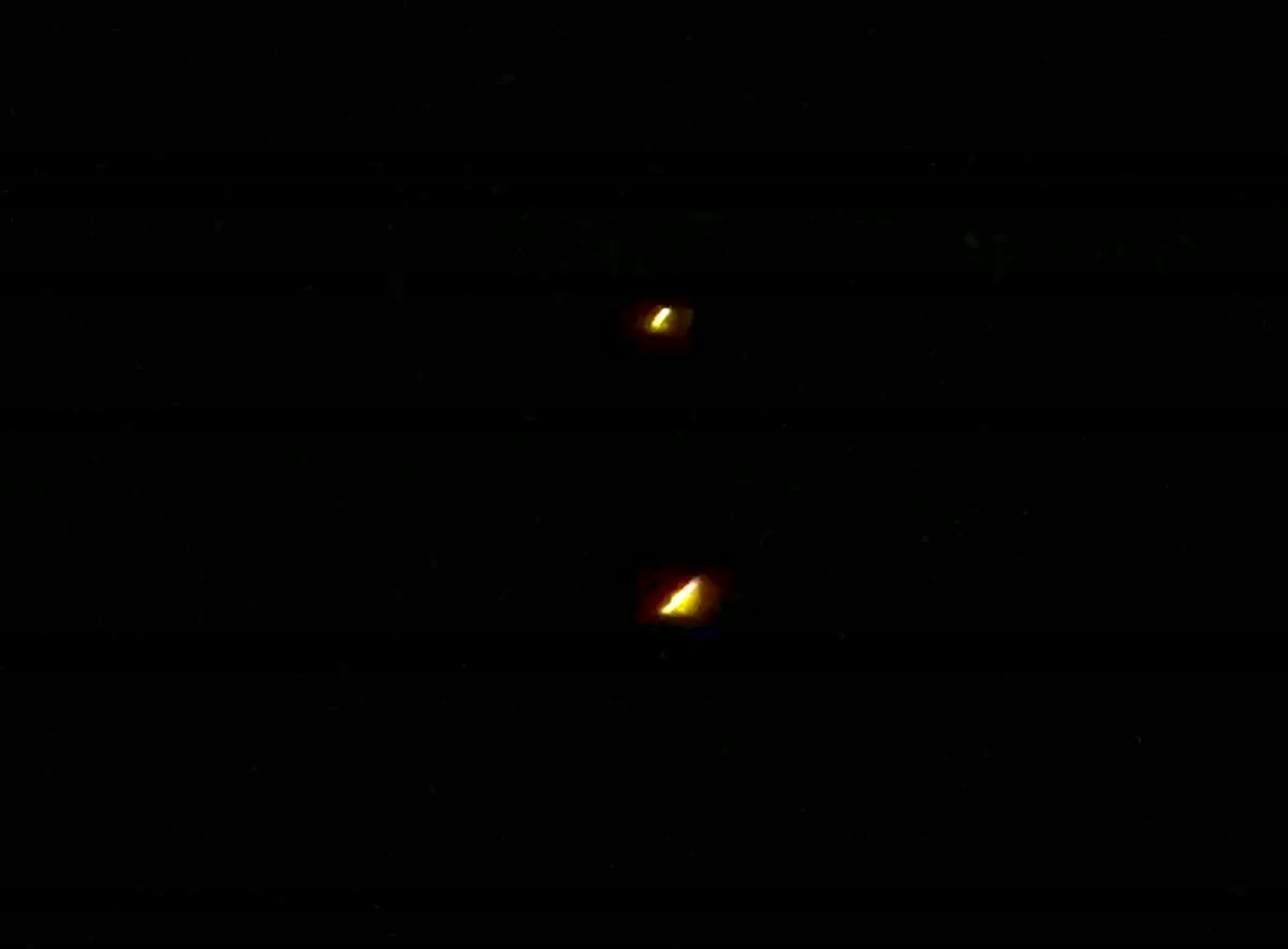 The "Gold Nuggets" Over Tenerife: Two Static Amber Lights and a Field of Moving Ones